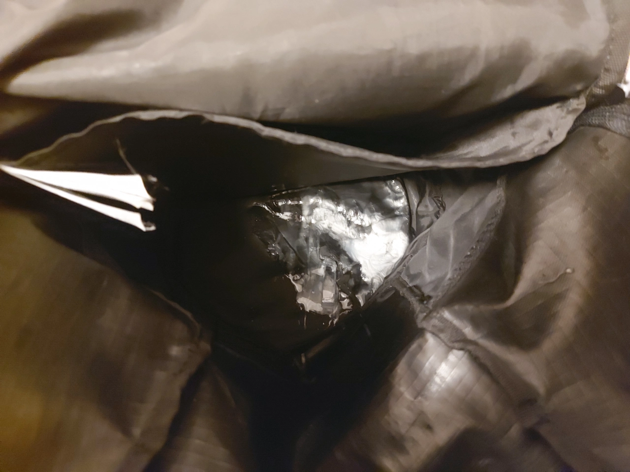 a bunch of spilled shampoo in my backpack